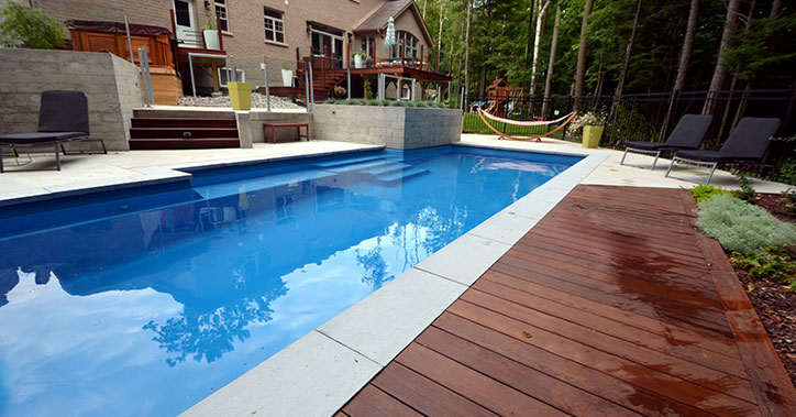 outdoor pool behind large house